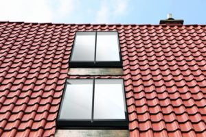 Roof window with roller shutter