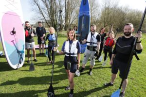 Russell roof tiles paddle boarding team