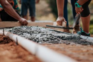 construction workers using concrete
