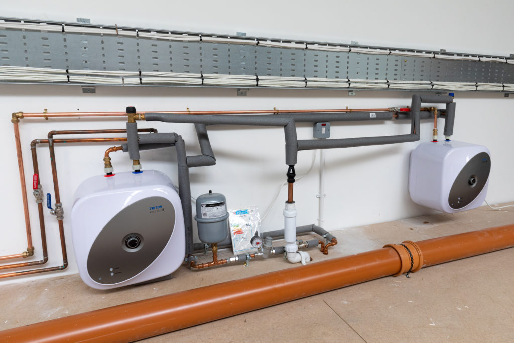 Step-by-step process of installing two Instaflow Stored Hot Water Heaters -  Professional Builder