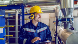 engineer looking at an oil boiler