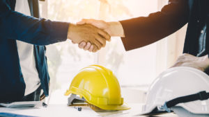 construction hand shaking